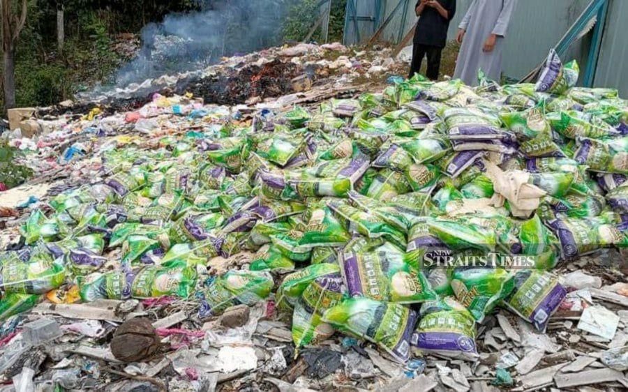 Scores of rice sacks, sardine tins and bags of flour were dumped near Pintasan Rumpun Makmur - Kampung Gunung Senyum, Pahang. - Pic courtesy of reader