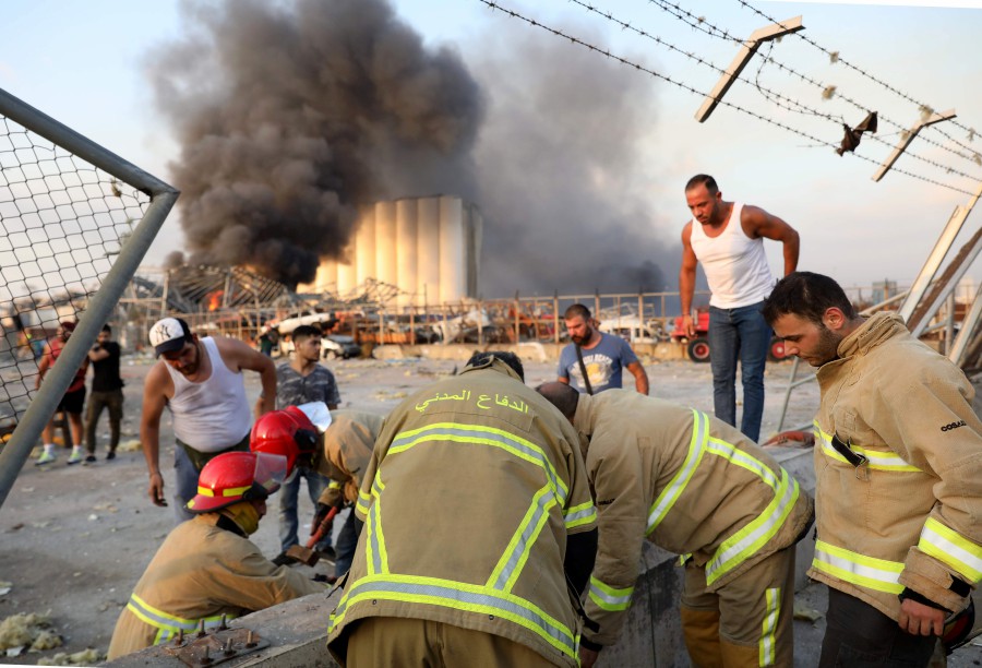  Lebanese firefighters work at the scene of an explosion in the Lebanese capital Beirut. -AFP pic