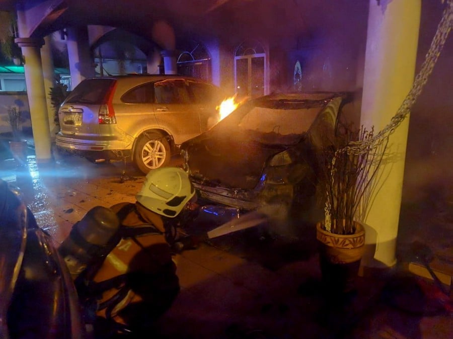 The house and three vehicles belonging to Beruas member of parliament Datuk Ngeh Koo Ham caught fire, believed to be the result of a Molotov cocktail, early this morning. -- Pic courtesy of Fire and Rescue Dept