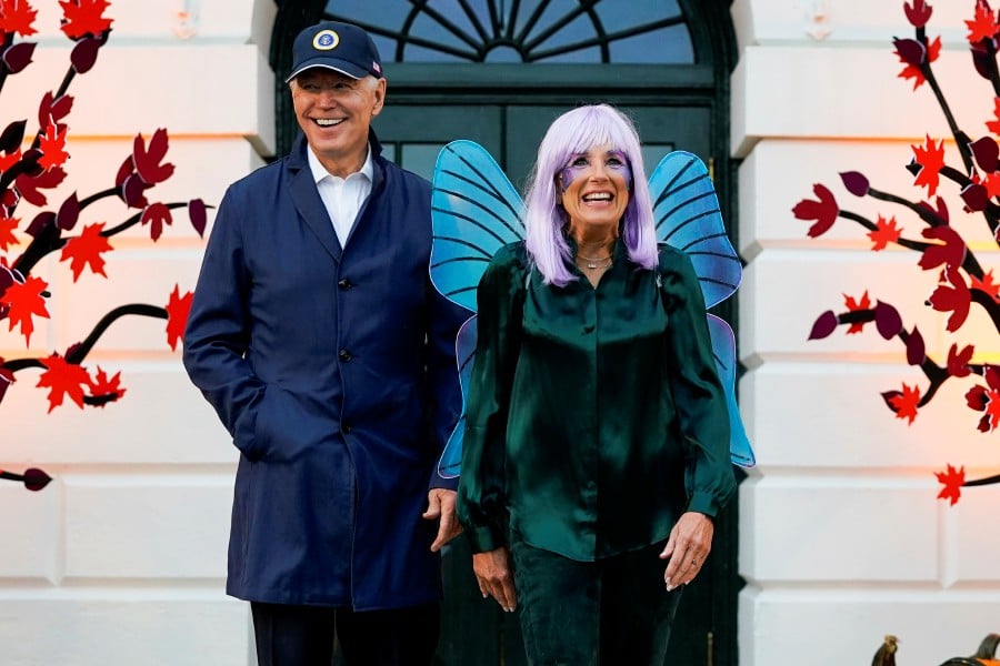President Joe Biden and first lady Jill Biden arrive to give treats to trick-or-treaters on the South Lawn of the White House, on Halloween, in Washington. - AP PIC