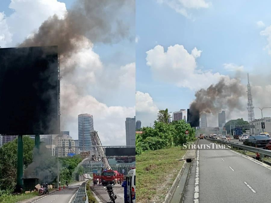 Three Indonesian workers were injured while six others escaped unharmed after the billboard they were on caught fire. - NSTP/NUR NAJLAA MOHD RAHMAT 