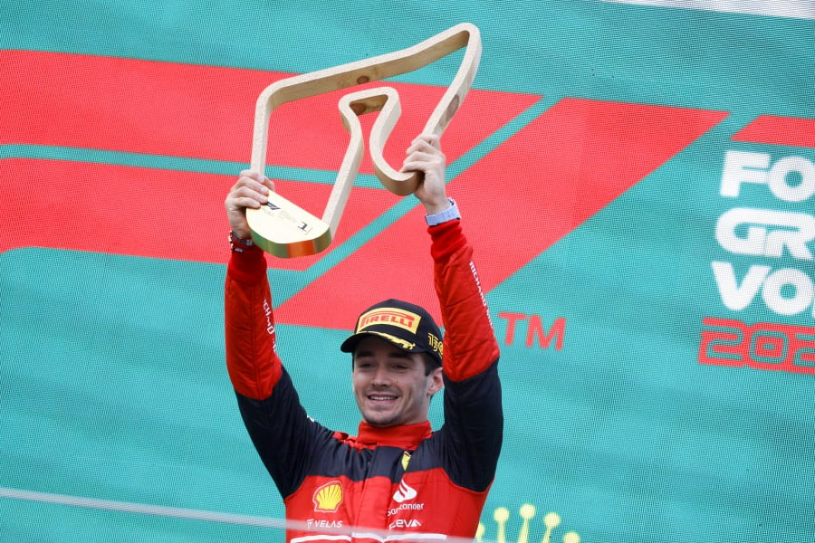 Monaco's Formula One driver Charles Leclerc of Scuderia Ferrari lifts his first place trophy after winning the Formula One Grand Prix of Austria at the Red Bull Ring in Spielberg, Austria, on July 10, 2022. -- Pic: EPA