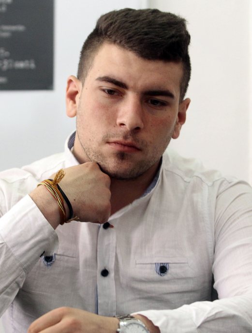 Photo taken on March 20, 2015, shows 22 year-old Bosnian Alen Muhic looking on during a press conference to announce the premierre of the documentary film "An Invisible Child's Trap" in Gorazde. Alen Muhic, abandoned at birth by his Muslim mother who was raped by a Serb soldier during Bosnia's 1990s war, 22 years later launched a quest for his biological parents. His painful and dramatic search was presented in a touching documentary filmed to break a taboo of those "invisible children" of conflicts and that had its premiere here earlier this month. AFP PHOTO 