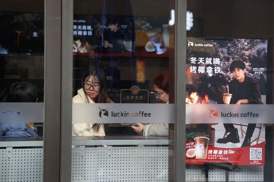 Customers wait for coffee in a Luckin Coffee store in Beijing, China. - Reuters pic