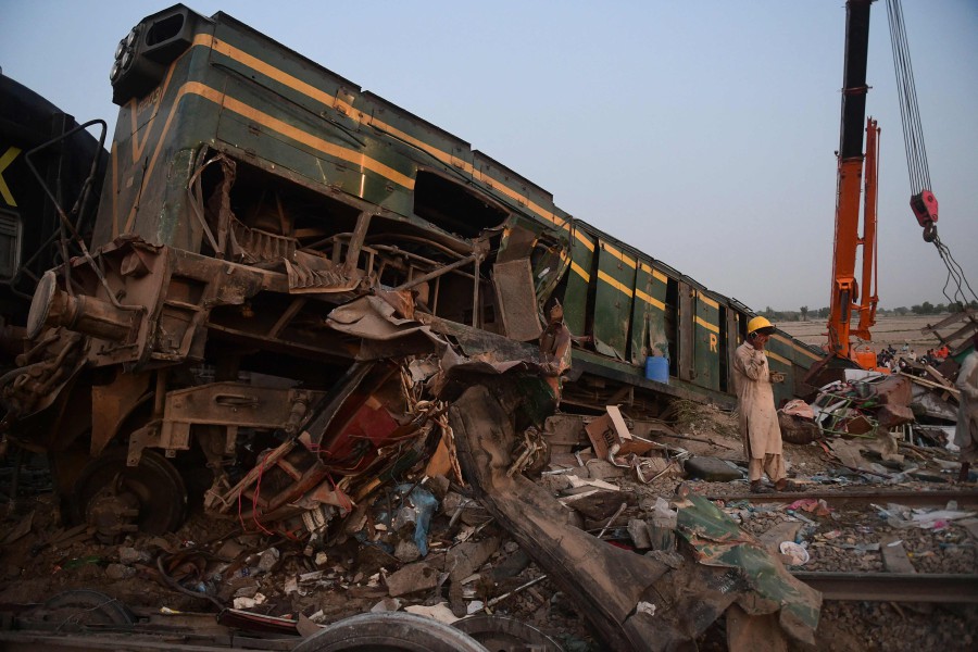  A railway worker stands at the site of a train accident in Daharki area of the northern Sindh province. - AFP Pic