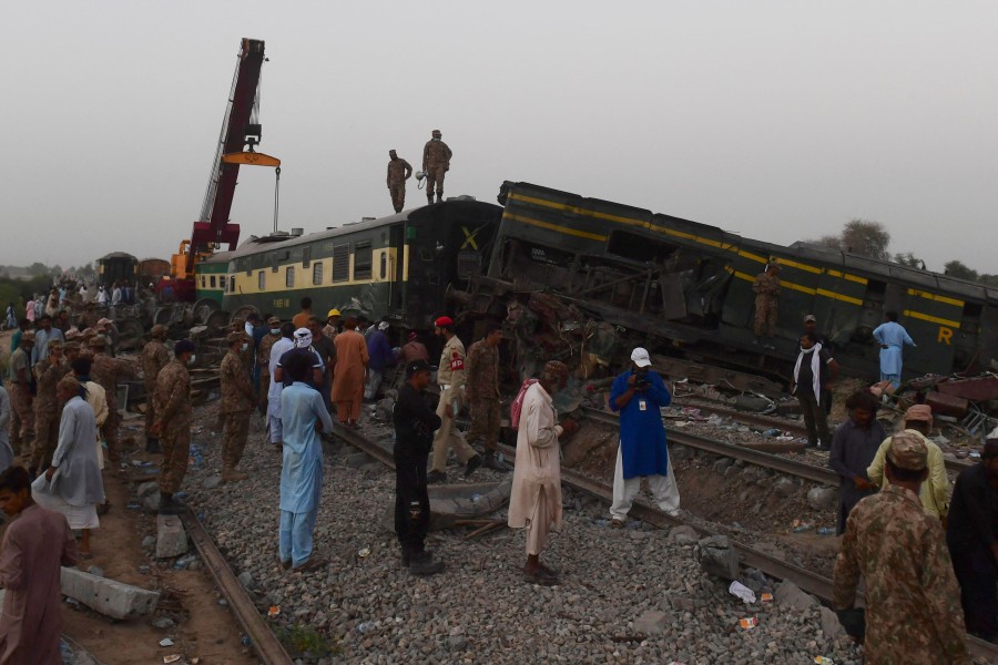 Security personnel carry out rescue operations at the site of a train accident in Daharki area of the northern Sindh province. - AFP Pic