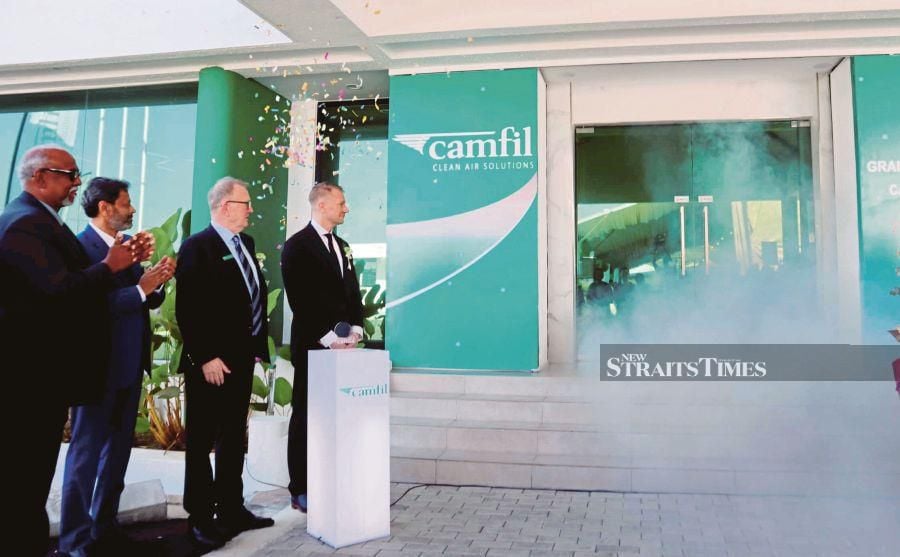 Swedish Ambassador to Malaysia Dr Joachim Bergström (right) launching Camfil Malaysia Sdn Bhd newly expanded manufacturing plant at Bemban Industrial Park in Batu Gajah, Perak, yesterday. Present are ( from left) Camfil president of Asia Pacific Alan O’ Connel (second from right) and Camfil Malaysia head of plant and vice-president (Asian Pacific supply chain) Karunagaran Krishnan (left).