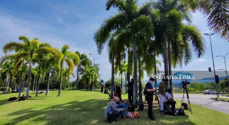 Members of the media seen waiting for the arrival of Prime Minister Datuk Seri Ismail Sabri Yaakob at Istana Abdul Aziz. -NSTP/FARIZUL HAFIZ AWANG