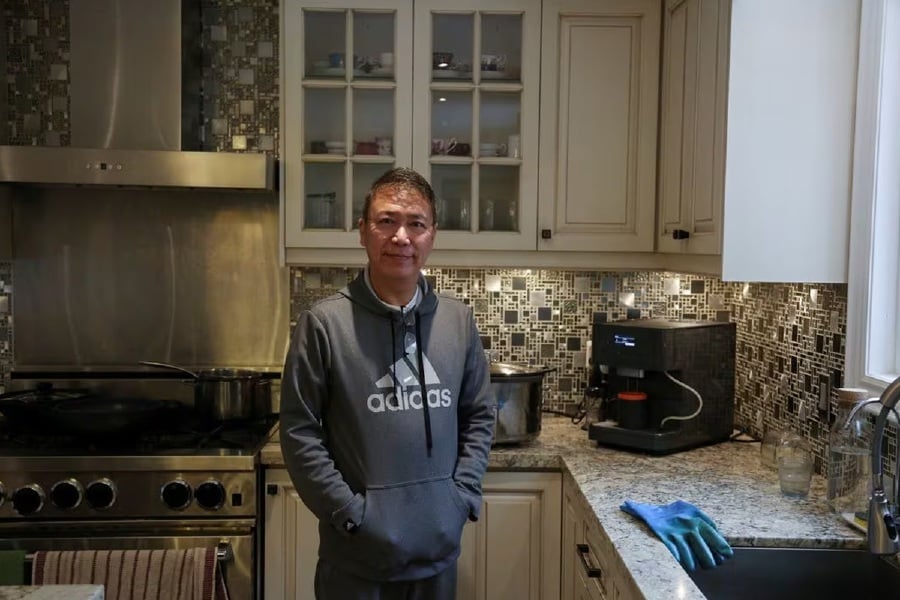 Myo Maung, 55, who immigrated from Myanmar to Canada over three decades ago, poses for photos at his home in Toronto, Ontario, Canada. - Reuters pic