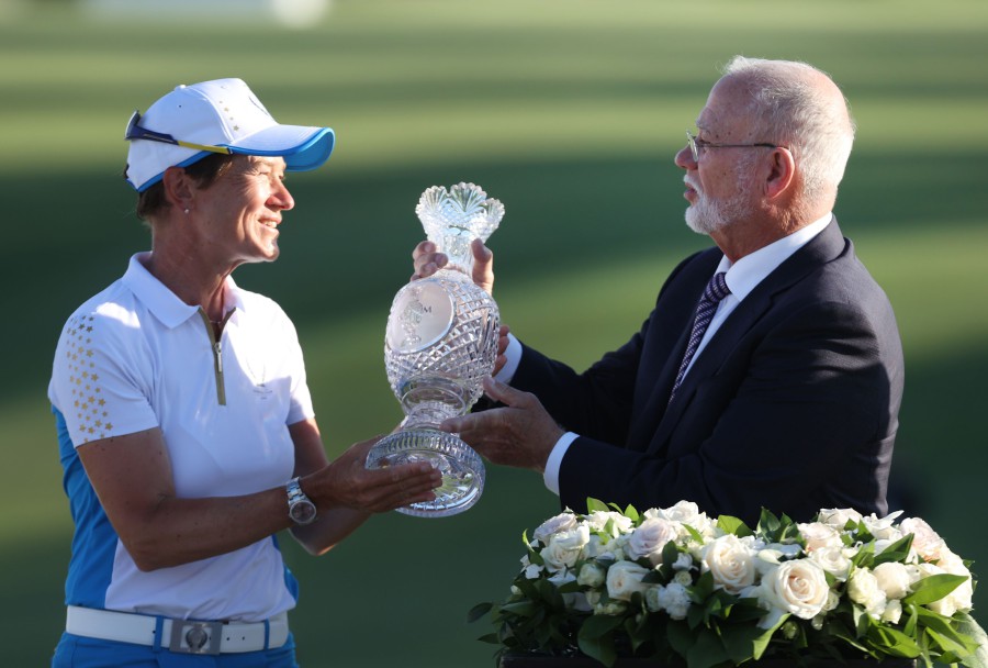  Team Europe Captain Catriona Matthew is presented the Solheim Cup by John Solheim, Chairman and CEO of PING after their win over Team USA during day three of the Solheim Cup at the Inverness Club on September 6, 2021 in Toledo, Ohio. - AFP PIC