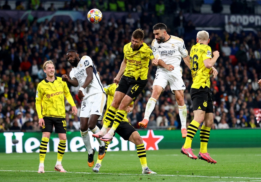 Real Madrid’s Dani Carvajal (second from right) scores during Saturday’s Champions League final against Borussia Dortmund at Wembley Stadium. - REUTERS PIC
