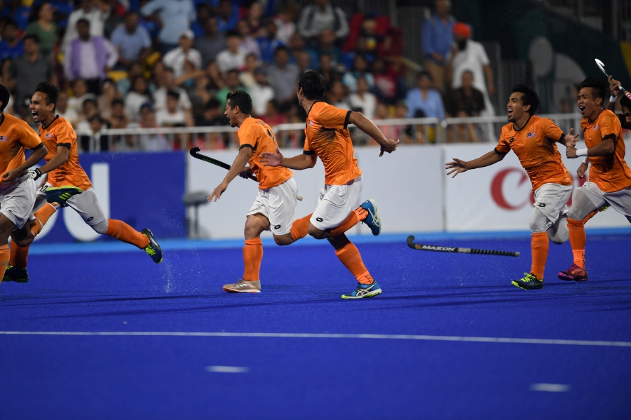Malaysia's players celebrate after their victory against India during the men's field hockey semi-final match between India and Malaysia at the 2018 Asian Games in Jakarta. AFP
