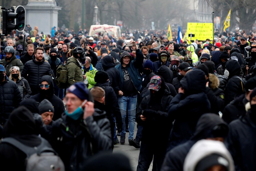  People take part in a protest against European anti-coronavirus measures, in Brussels, Belgium. - EPA PIC