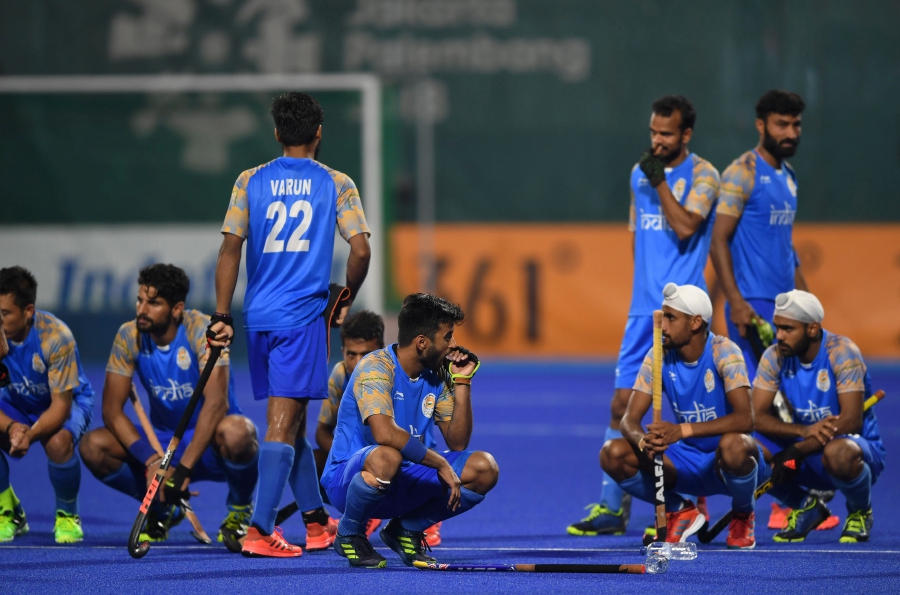 India's players react after losing to Malaysia during the men's field hockey semi-final match between India and Malaysia at the 2018 Asian Games in Jakarta. AFP