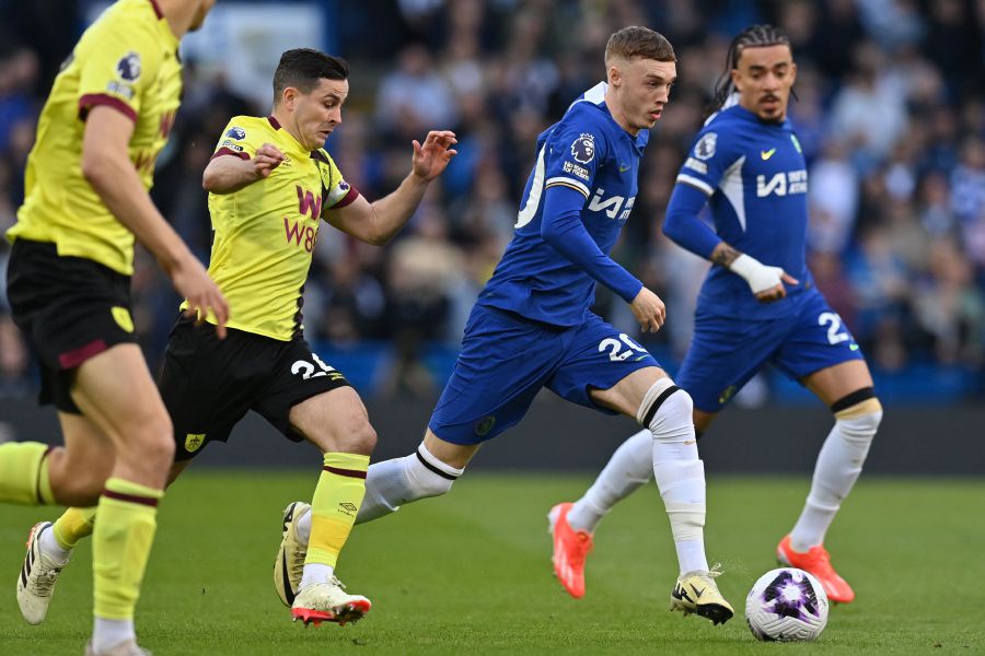 Chelsea's English midfielder Cole Palmer (2nd right) runs away from Burnley's Northern Irish midfielder Josh Cullen (left) during the English Premier League football match between Chelsea and Burnley at Stamford Bridge in London. — AFP pic