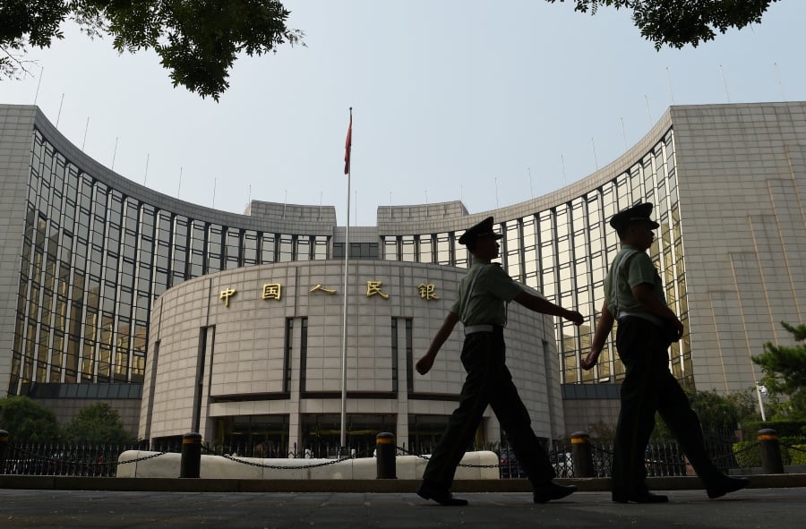 China’s long-dated government bond yields rose in early trade on Friday, as traders heeded the central bank’s fresh warning against risks in the country’s bullish treasuries market. AFP pic