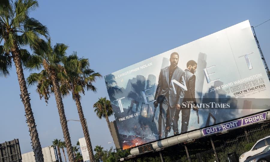A billboard for Christopher Nolan's film "Tenet" on the Sunset Strip, in West Hollywood, California. "Tenet," Christopher Nolan's hotly awaited sci-fi epic, will release internationally on August 26 before hitting a limited number of US screens in September, Warner Bros said. AFP photo