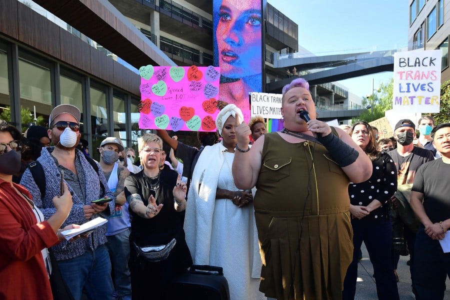 People rally in support of the Netflix transgender walkout in Los Angeles, California. - AFP PIC