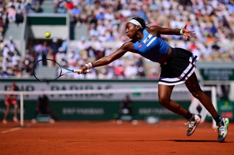 US Coco Gauff returns the ball to Russia's Mirra Andreeva during their women's singles match on day seven of the Roland-Garros Open tennis tournament at the Court Suzanne-Lenglen in Paris. - AFP PIC