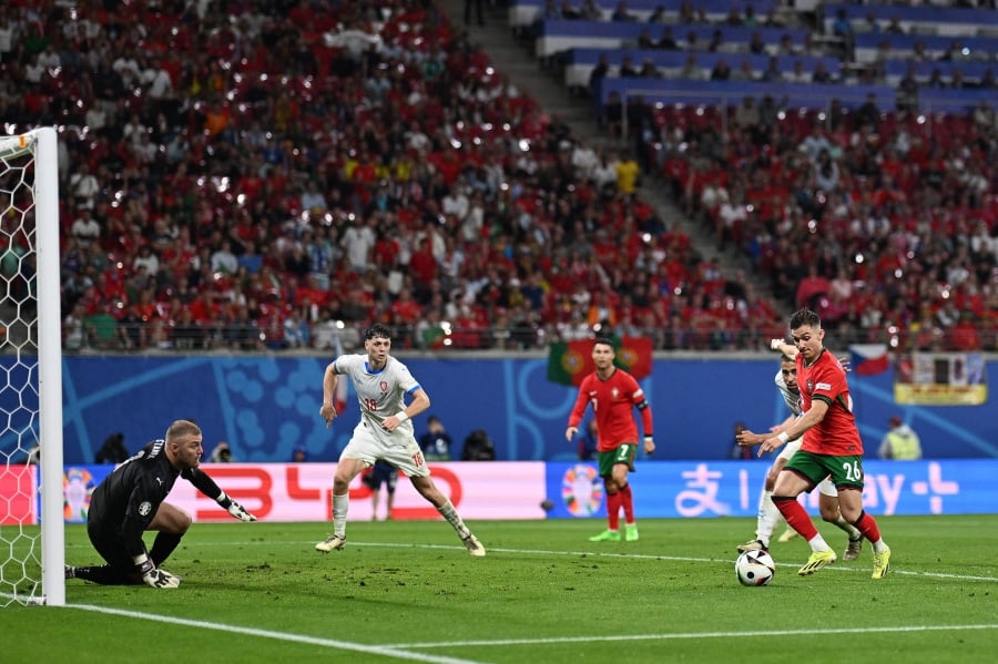 Portugal’s Francisco Conceicao (right) shoots and scores their second goal against the Czech Republic during Tuesday’s Euro 2024 Group F match at the Leipzig Stadium. - AFP PIC