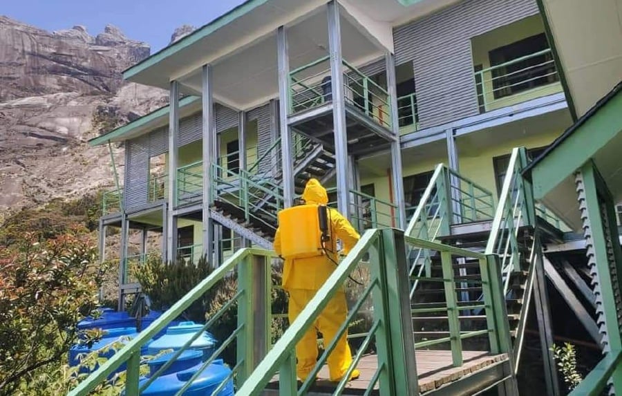 Sabah Parks staff conducting a disinfection exercise at the Panalaban site of Mount Kinabalu. – Pic courtesy of Sabah Parks