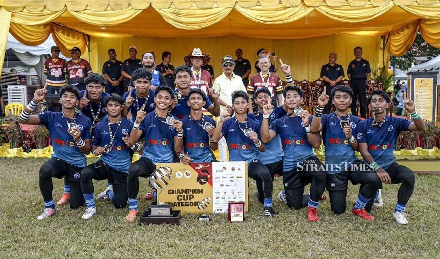 Tunku Mahkota Ismail Sports School players celebrate winning the Malay College Kuala Kangsar (MCKK) Premier Sevens title.