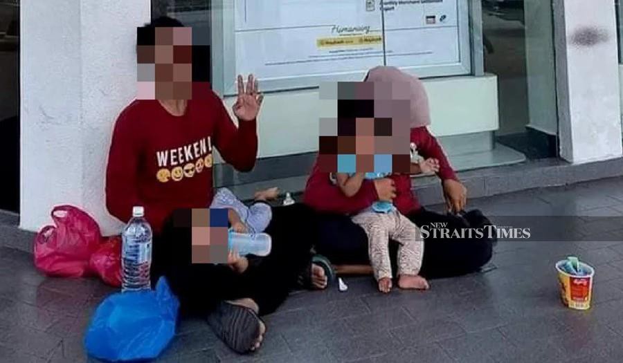 A jobless man has sought sympathy from the public by bringing along his wife and two children to seek donations near banks and restaurants in order to buy drugs. Pic from socmed.