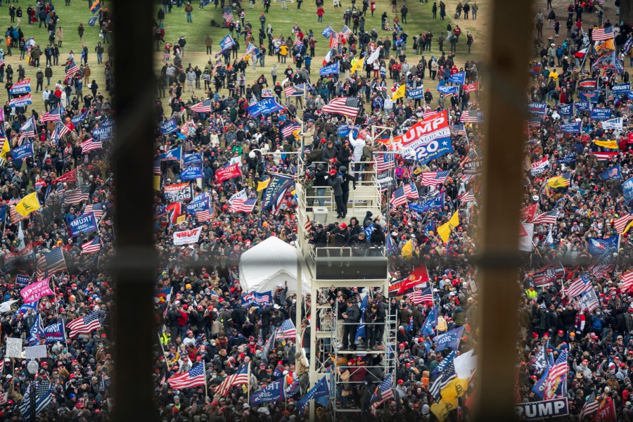 Supporters of US President Donald J. Trump and his baseless claims of voter fraud breach Capitol security and climb the inauguration stand to protest Congress certifying Joe Biden as the next president in Washington, DC. -EPA pic