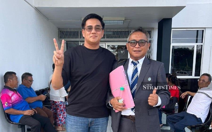 Daing Muhammad Reduan Bachok (right) with his counsel, Amli Nohin after the court proceedings today. -Pic courtesy of counsel