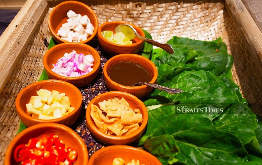 Miang Khana, a do it yourself kale wrap with fresh ingredients.