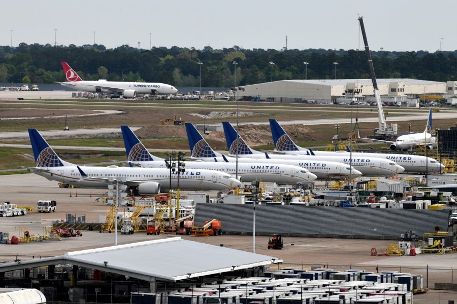 FILE PHOTO: United Airlines planes, including a Boeing 737 MAX 9 model, are pictured at George Bush Intercontinental Airport in Houston, Texas, U.S., March 18, 2019. -- REUTERS