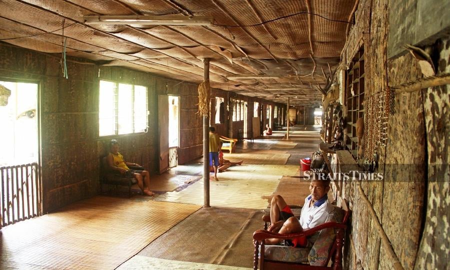 Residents awaiting the arrival of Gawai guests in the tranquil verandah of Ng Mengkak, Ulu Engkari Longhouse.