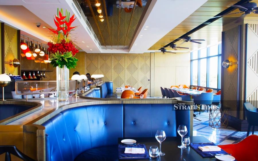Horizon Grill's air-conditioned area enables diners to watch all the cooking action from the open kitchen.