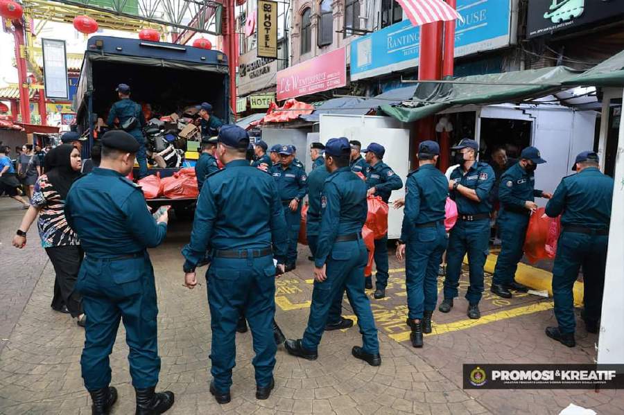 City Hall enforcement officers making their rounds along Petaling Street. - Pic courtesy of DBKL