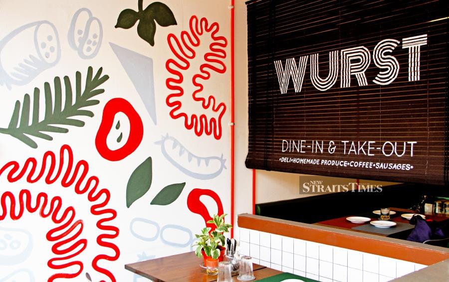 Dine amongst the colourful murals lining the walls of Wurst.