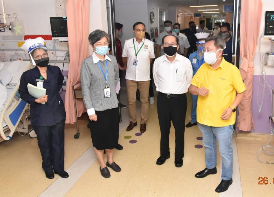 Deputy Chief Ministers Datuk Amar Douglas Uggah (second right) and Datuk Seri Dr Sim Kui Hian (right) visiting the Sarawak General Hospital in Kuching today. -- Pic courtesy of DCM's Office.