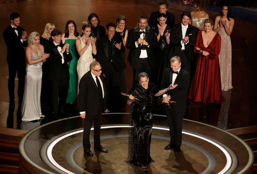 FILE PHOTO: Director Christopher Nolan and Producers Emma Thomas and Charles Roven win the Oscar for Best Picture for "Oppenheimer" during the Oscars show at the 96th Academy Awards in Hollywood, March 10, 2024. -- Pic: REUTERS Filepic
