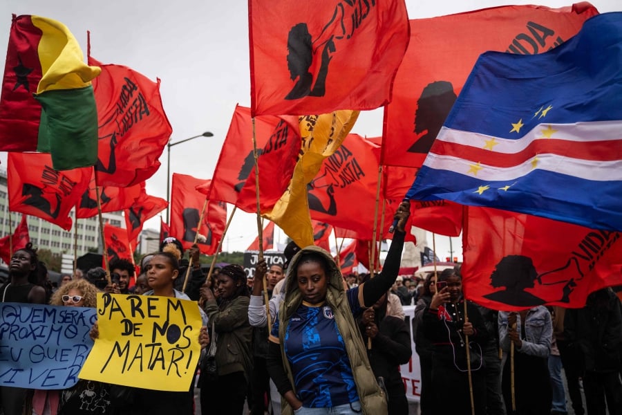 People take part in a demonstration against police use of force and racism following a week of unrest sparked by the shooting of a black man by officers, in Lisbon on Saturday. - AFP PIC