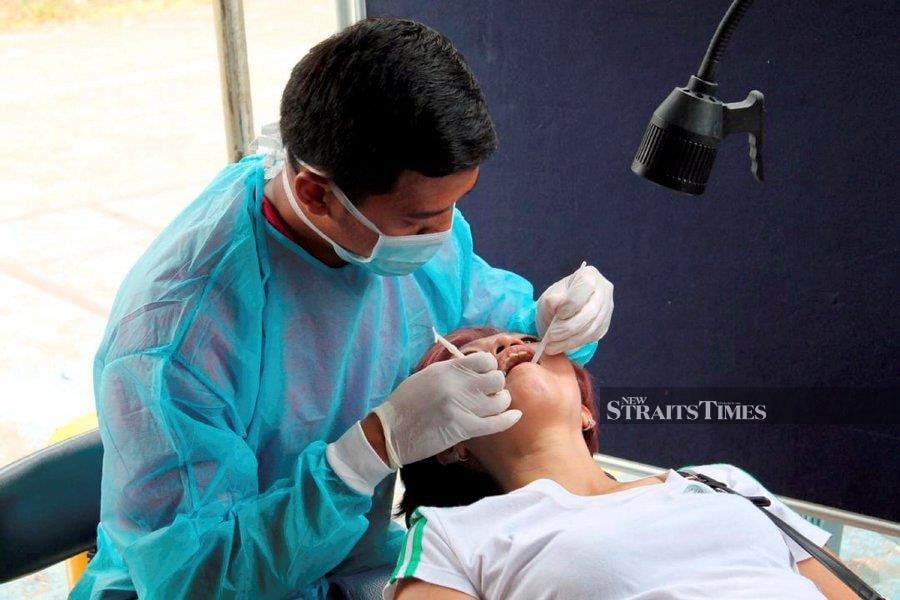 We should visit a dentist at least once a year, even if we brush our teeth regularly. - NSTP file pic