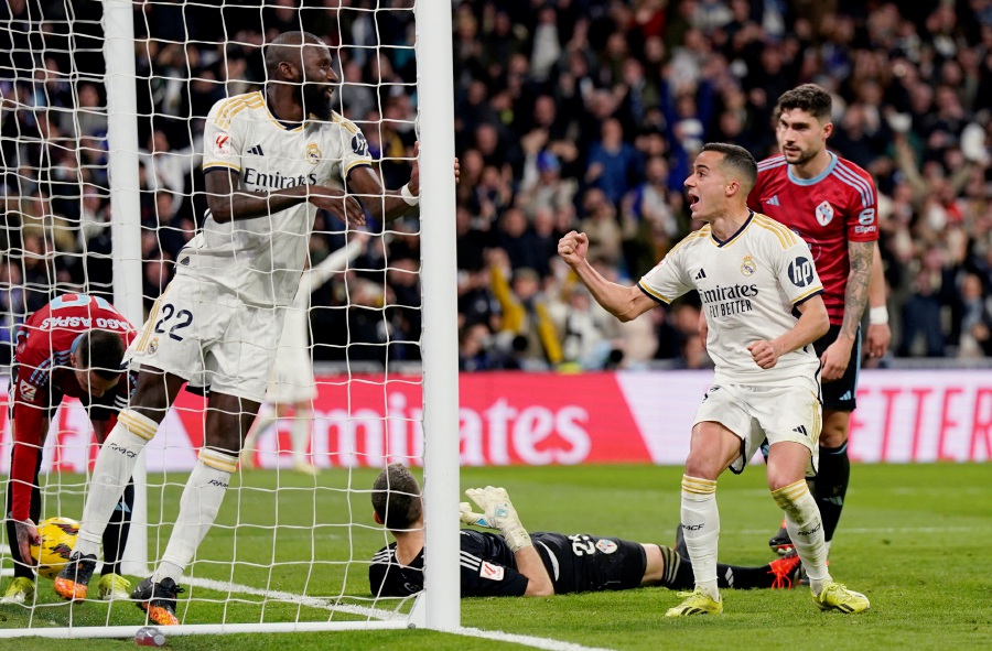 Real Madrid's Brahim Diaz and Antonio Rudiger celebrates their second goal, an own goal scored by Celta Vigo's Vicente Guaita. (REUTERS/Ana Beltran)