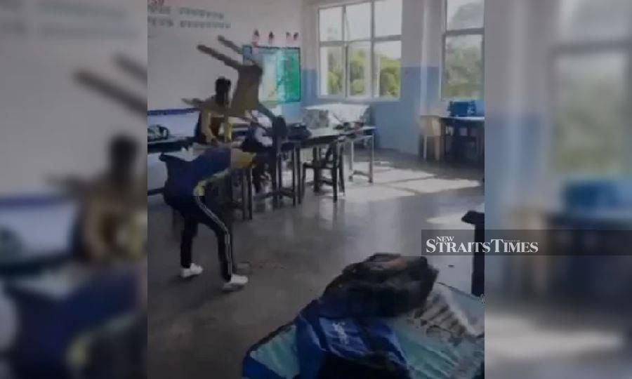 This screengrab from a viral video, shows students allegedly damaging a school’s properties in Penang, recently. 