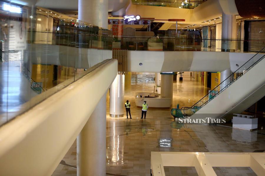 Security officers on duty at a mall in Johor Baru on June 30. -NSTP/NUR AISYAH MAZALAN