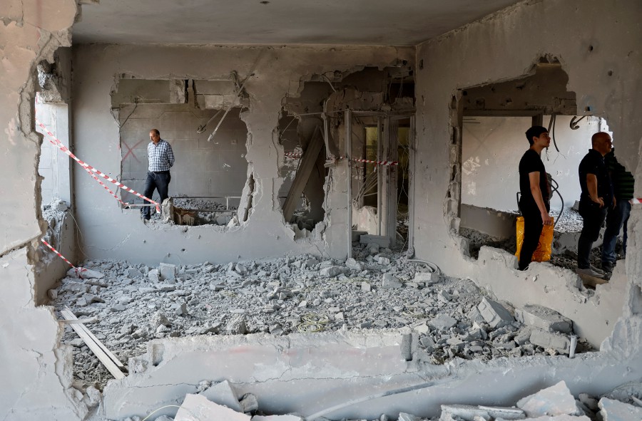 People inspect a house demolished by the Israeli army in Nablus, in the Israeli-occupied West Bank. (REUTERS/Raneen Sawafta)
