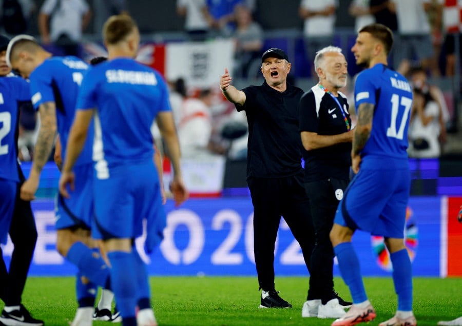 Slovenia coach Matjaz Kek reacts after the match. --REUTERS