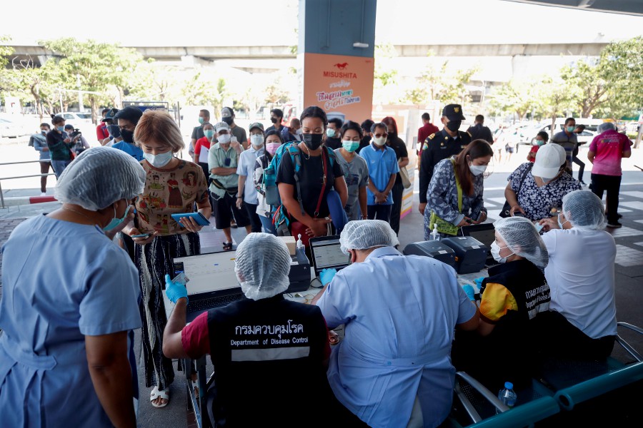  Travelers register for Covid-19 coronavirus antigen tests after arriving at Mo Chit - Bangkok Bus Terminal, in Bangkok, Thailand. - EPA PIC