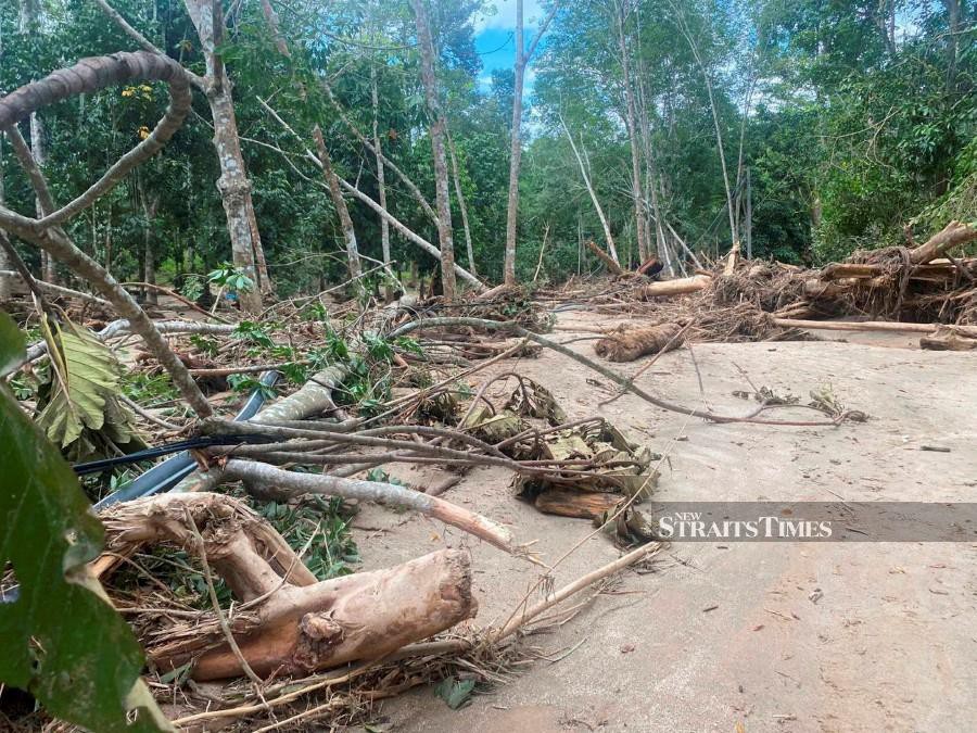 This file pic dated July 6, 2022, shows the aftermath following the floods in Gunung Inas ,Kampung Iboi, Kupang, in Baling. -NSTP/M HIFZUDDIN IKHSAN