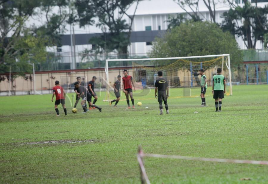 Students playing football at SMK Seri Titiwangsa in Kuala Lumpur. - NSTP/SYARAFIQ ABD SAMAD