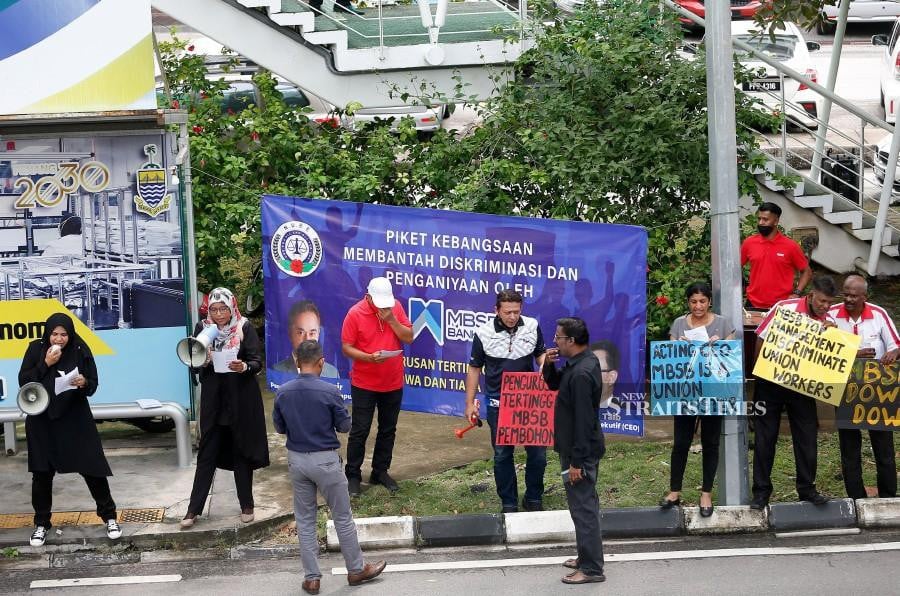 Members of NUBE staging a protest at outside a bank branch in Jalan Sultan Ahmad Shah, Penang. -NSTP/MIKAIL ONG