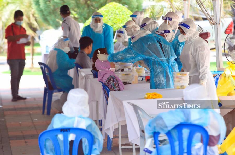 This April 14 pic shows civil servants at Seri Iman  Complex undergoing Covid-19 screening in Kuala Terengganu. -NSTP/GHAZALI KORI