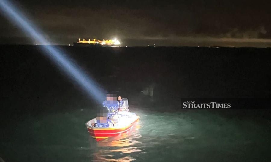 This images shared by an enforcement agency shows a boat allegedly ferrying illegal migrants at an undisclosed location. - NSTP file pic